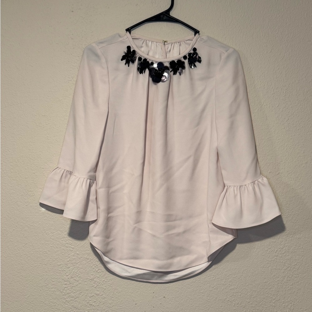 Elegant Cream Blouse with Black Embellishments